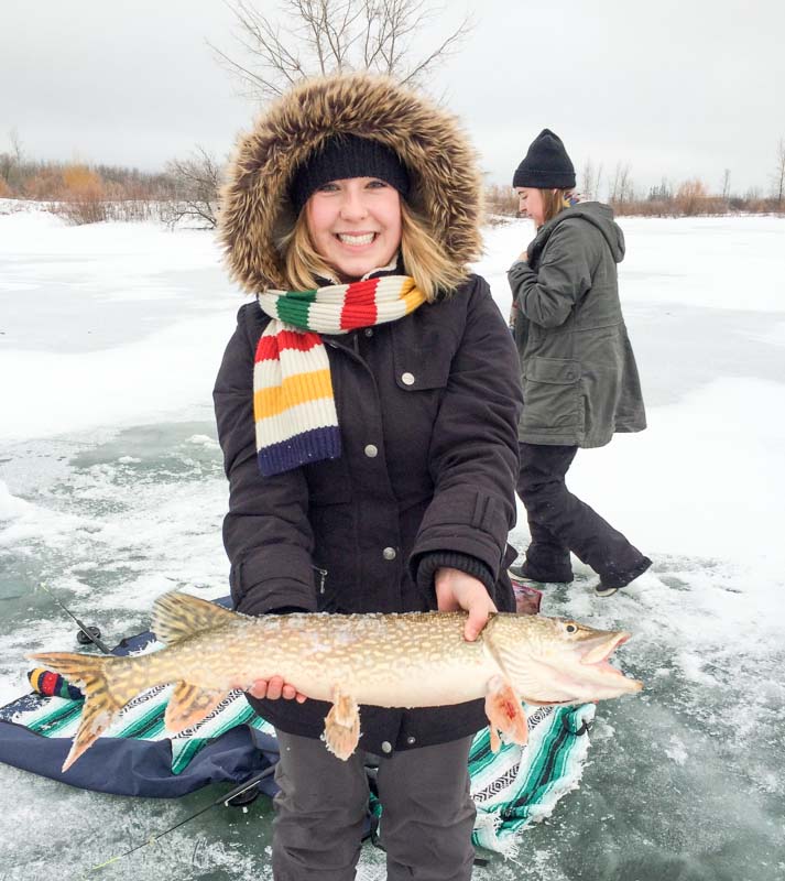 FortWhyte visitor holding fishing catch