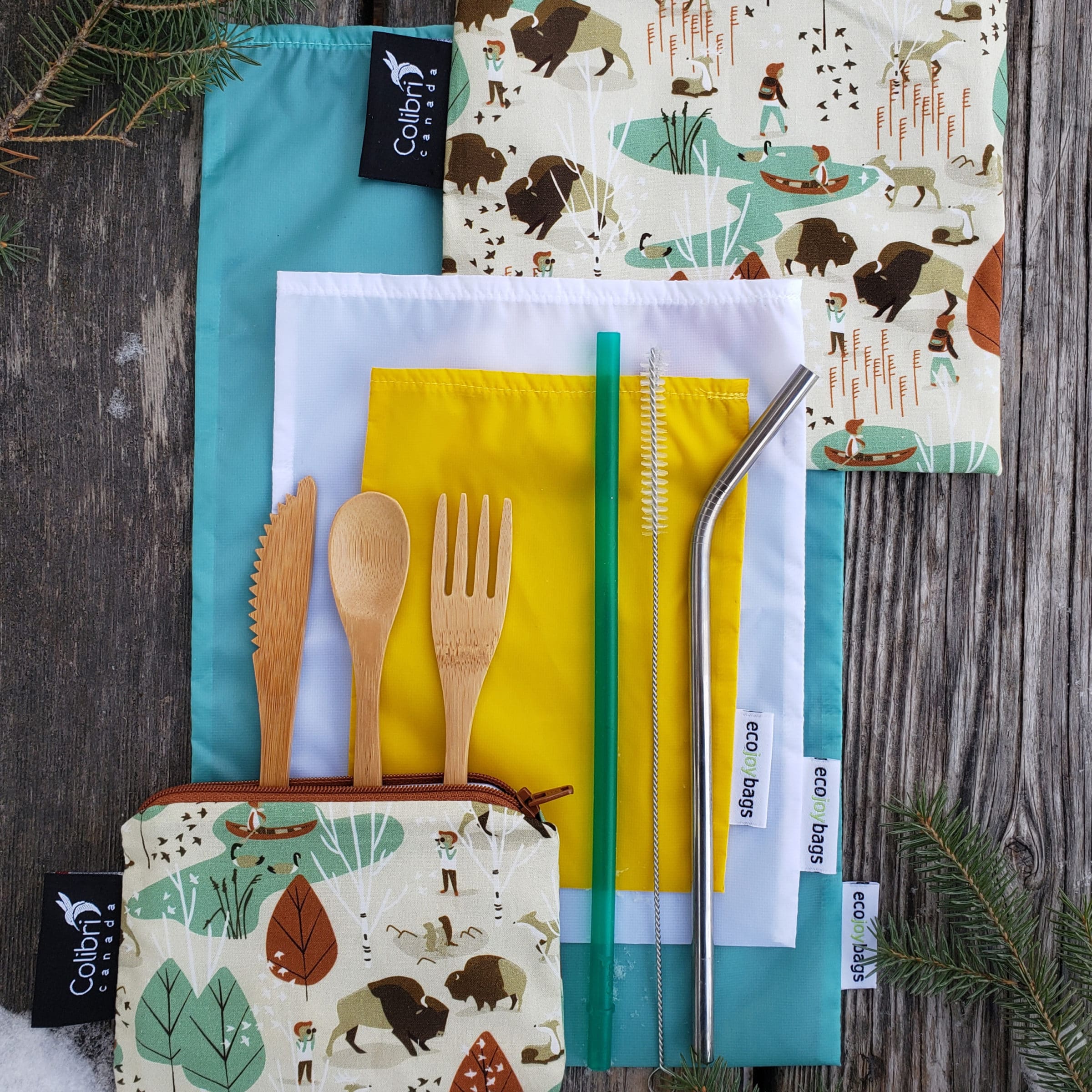 Sustainable supplies from the Nature Shop, including bamboo cutlery, a metal straw, and cloth bags.