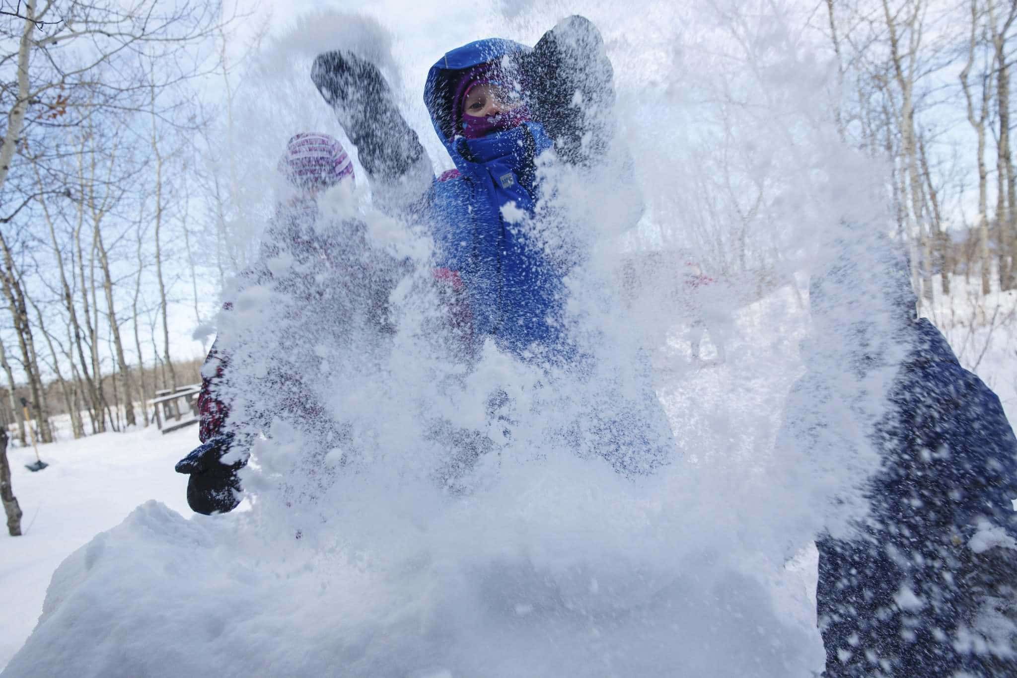 Child playing in the snow.