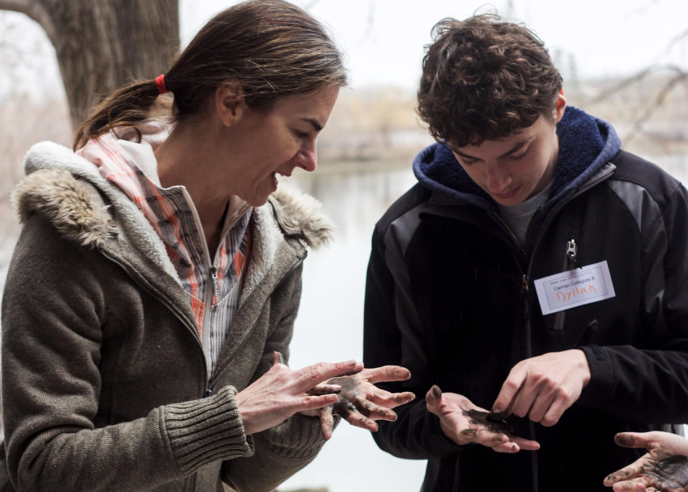 teacher explaining the properties of soil to a student
