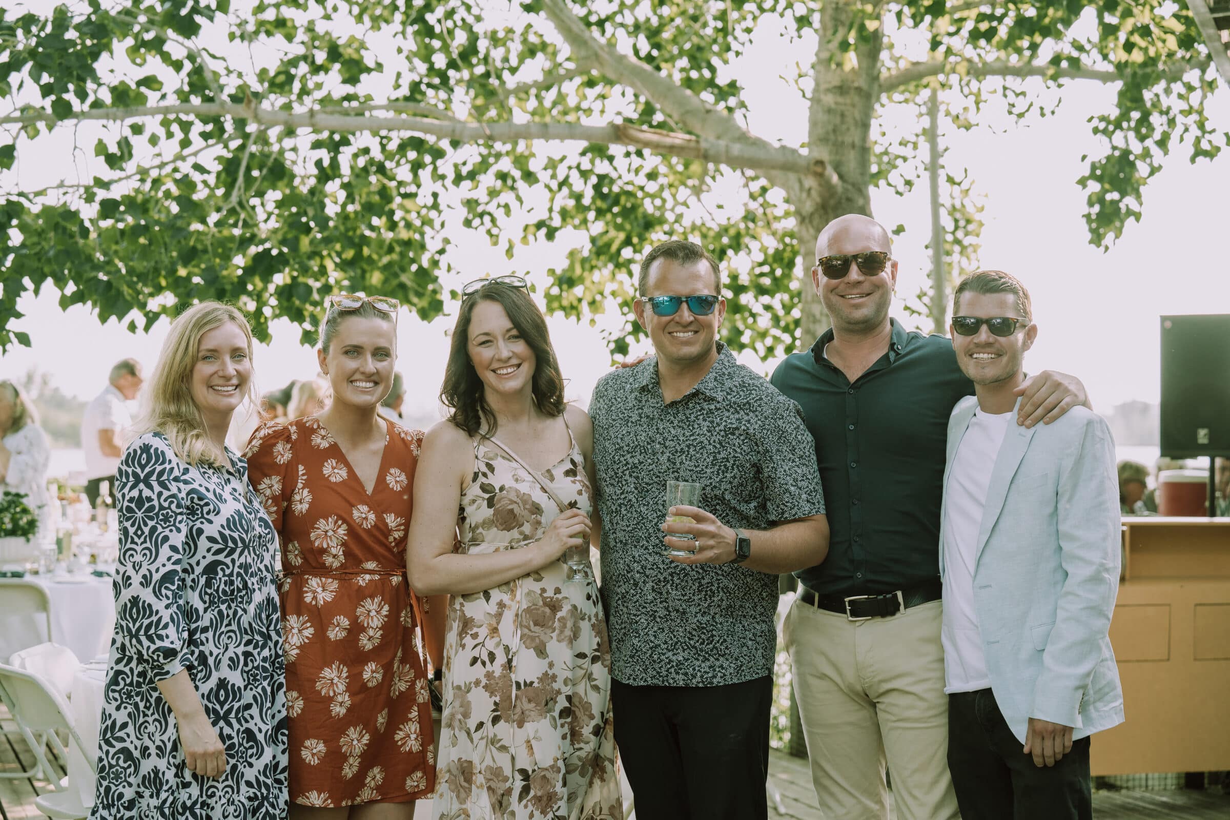Group of people stands smiling at camera