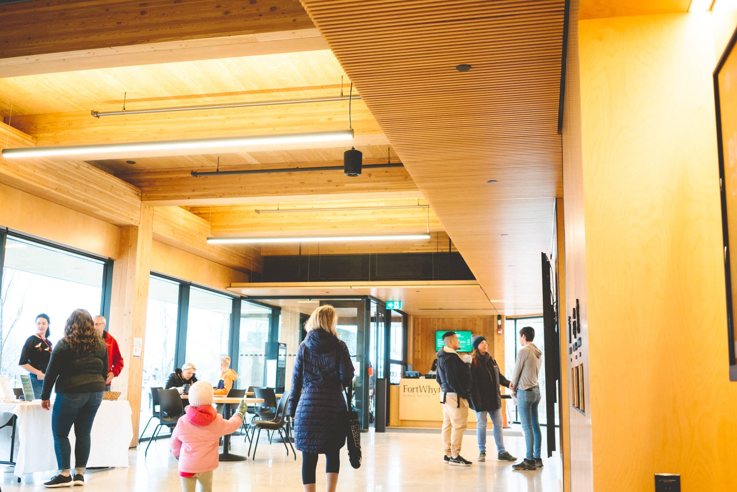 people walking through visitor centre