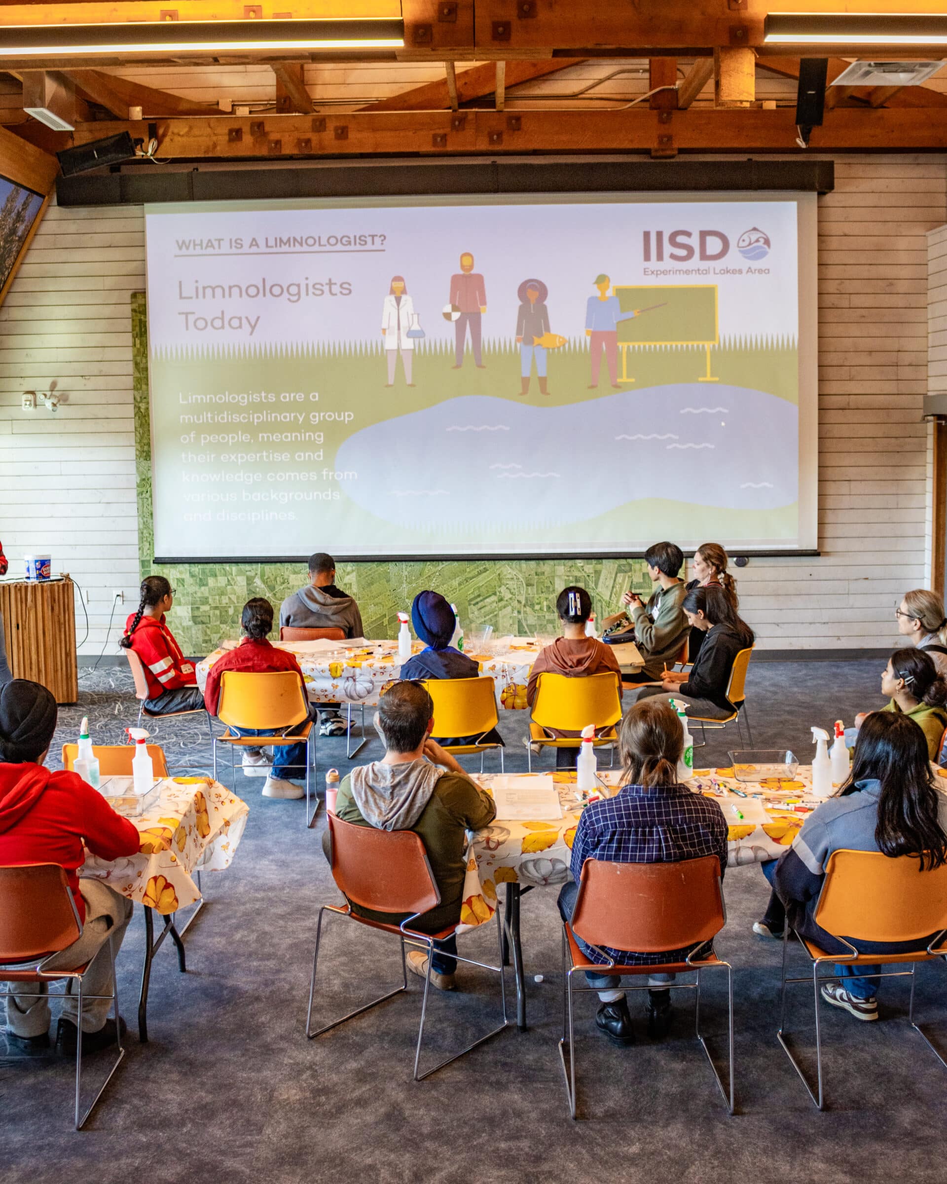 students watch presentation